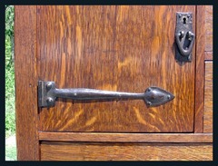 Close-up of buffet door and hand hammered hardware.